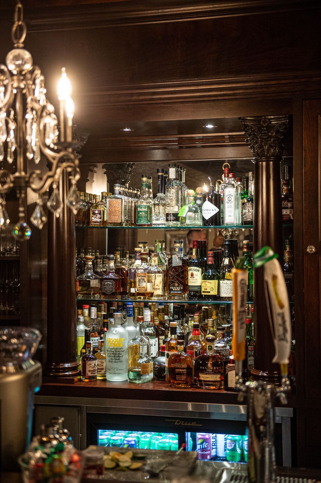 The back bar — shelves of bourbon and the tap tower