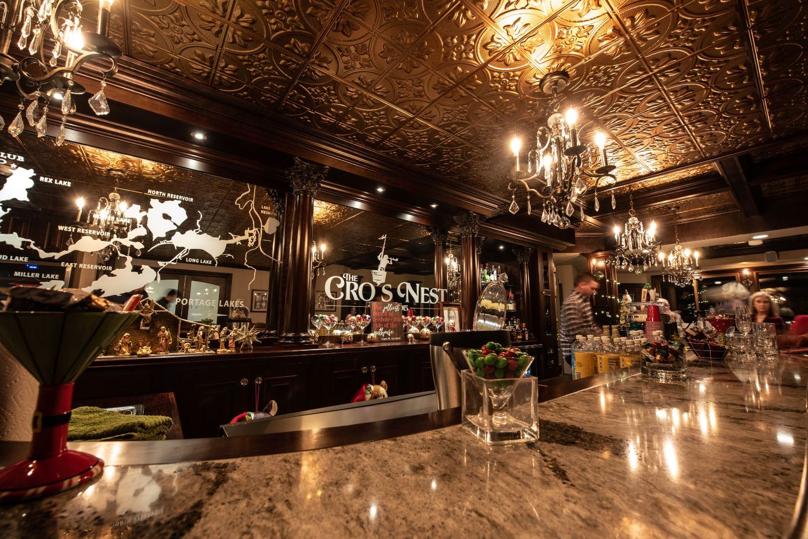 Thirty-eight feet of granite bar and the etched mirror behind it